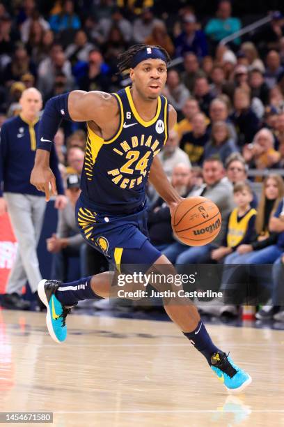 Buddy Hield of the Indiana Pacers drives to the basket in the game against the Toronto Raptors at Gainbridge Fieldhouse on January 02, 2023 in...