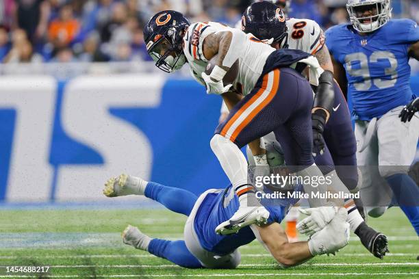 David Montgomery of the Chicago Bears tries to break a tackle by John Cominsky of the Detroit Lions in the second half of a game at Ford Field on...