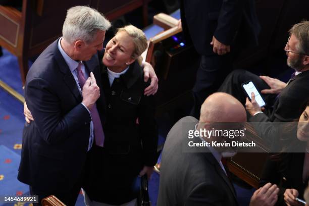 House Republican leader Kevin McCarthy embraces Rep.-elect Majorie Taylor Greene in the House Chamber during the fourth day of elections for Speaker...