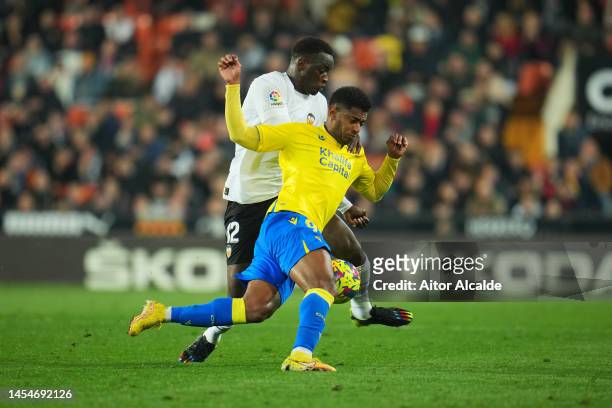 Mouctar Diakhaby of Valencia CF and Anthony Lozano of Cadiz CF battle for the ball during the LaLiga Santander match between Valencia CF and Cadiz CF...