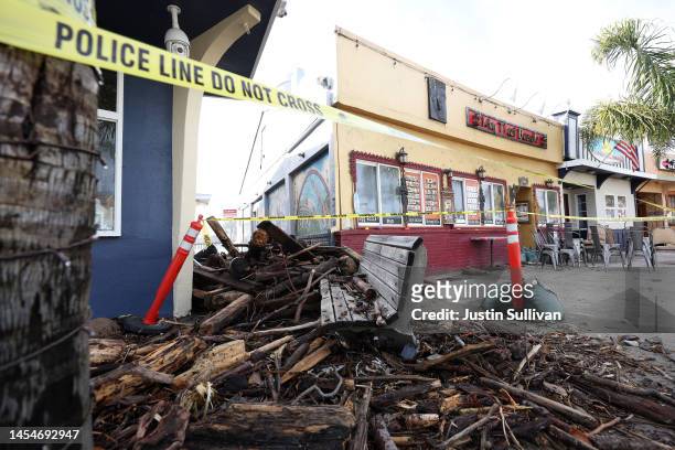 Debris is seen piled up in front of a restaurant following a massive storm that hit the area on January 06, 2023 in Capitola, California. A powerful...