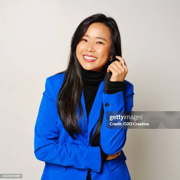 studio portrait of a woman - blue blazer stock pictures, royalty-free photos & images