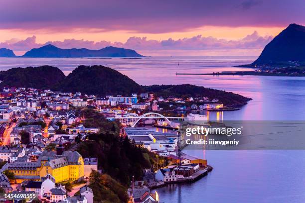 evening photo of alesund city in norway. - alesund noorwegen stock pictures, royalty-free photos & images