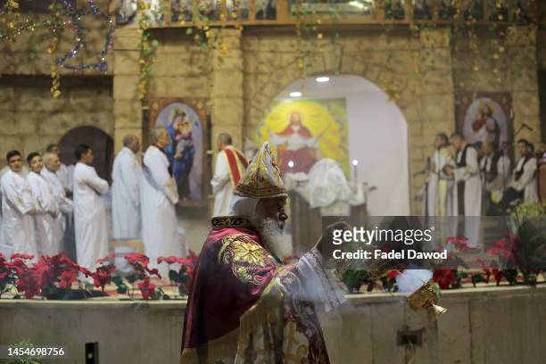 Coptic Orthodox worshippers attend Christmas Eve mass at the Nativity of Christ Cathedral In the Monastery of Anba Samaan Al-Kharaz in the Mokattam...