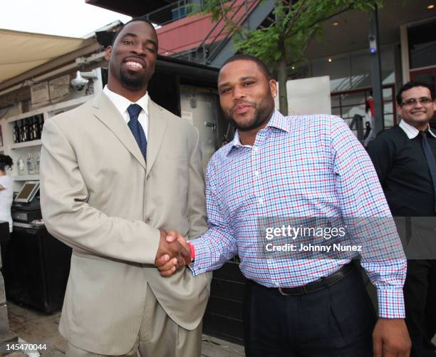 Justin Tuck and Anthony Anderson attend the NY Giants Justin Tuck VIP charity reception at the Beekman Beer Garden on May 30, 2012 in New York City.