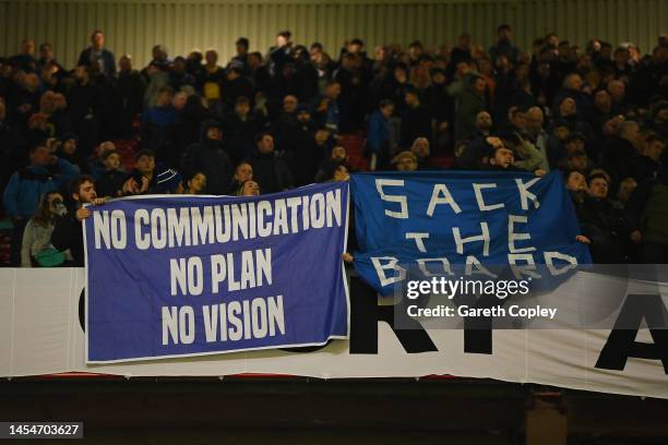 Everton fans display banners protesting the club board during the Emirates FA Cup Third Round match between Manchester United and Everton at Old...