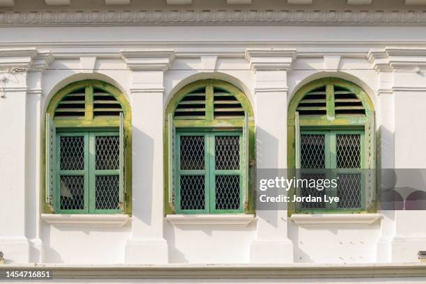 three green heritage windows of historic building - heritage classic fotografías e imágenes de stock