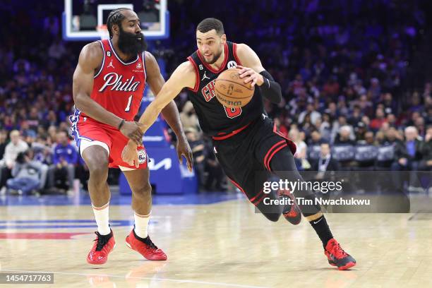 Zach LaVine of the Chicago Bulls drives past James Harden of the Philadelphia 76ers during the second quarter at Wells Fargo Center on January 06,...