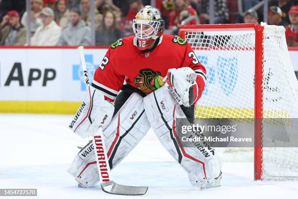 Alex Stalock of the Chicago Blackhawks tends the net against the Arizona Coyotes during the first period at United Center on January 06, 2023 in...