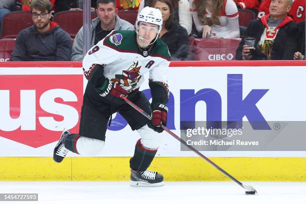 Clayton Keller of the Arizona Coyotes skates with the puck against the Chicago Blackhawks during the first period at United Center on January 06,...