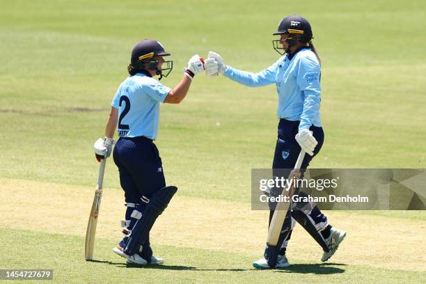 Sammy-Jo Johnson of the NSW Breakers celebrates hitting a six during the WNCL match between Victoria and New South Wales at CitiPower Centre on...