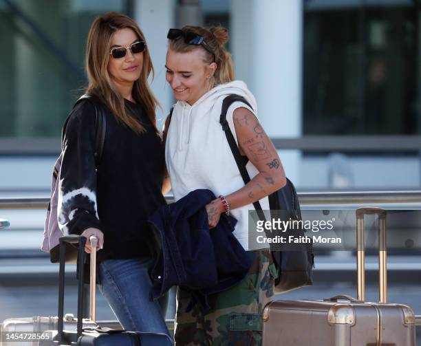 Flip and Chrishell Stause arrive at Perth Airport on January 7 in Perth, Australia.