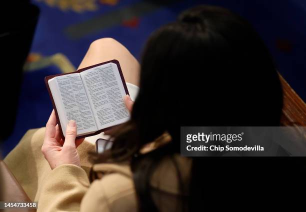 Rep.-elect Anna Paulina Luna reads a Bible in the House Chamber during the fourth day of voting for Speaker of the House at the U.S. Capitol Building...