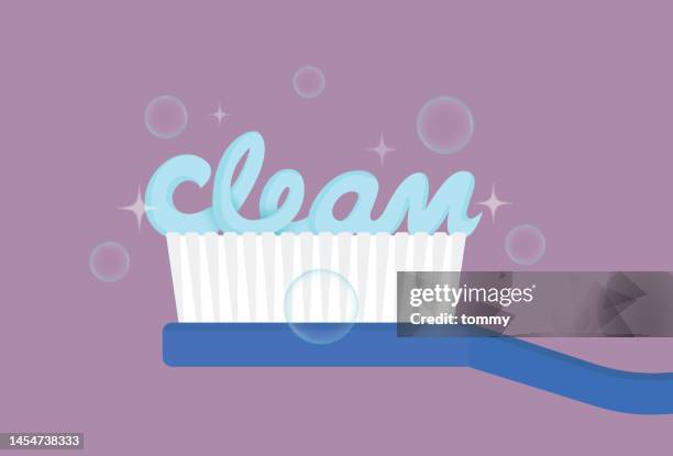 toothbrush with a clean text - toothache cartoon stock illustrations