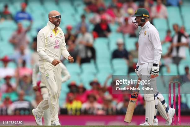 Nathan Lyon of Australia celebrates dismissing Sarel Erwee of South Africa during day four of the Third Test match in the series between Australia...