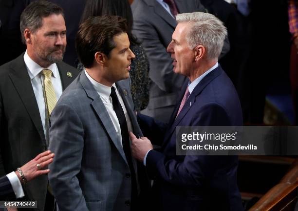 House Republican Leader Kevin McCarthy talks to Rep.-elect Matt Gaetz in the House Chamber after Gaetz voted present during the fourth day of voting...