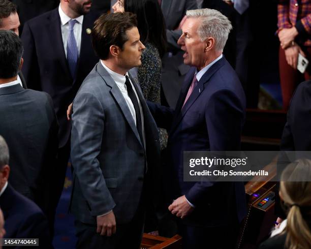 House Republican Leader Kevin McCarthy talks to Rep.-elect Matt Gaetz in the House Chamber after Gaetz voted present during the fourth day of voting...