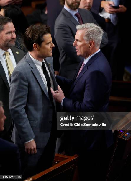 House Republican Leader Kevin McCarthy talks to Rep.-elect Matt Gaetz in the House Chamber during the fourth day of elections for Speaker of the...