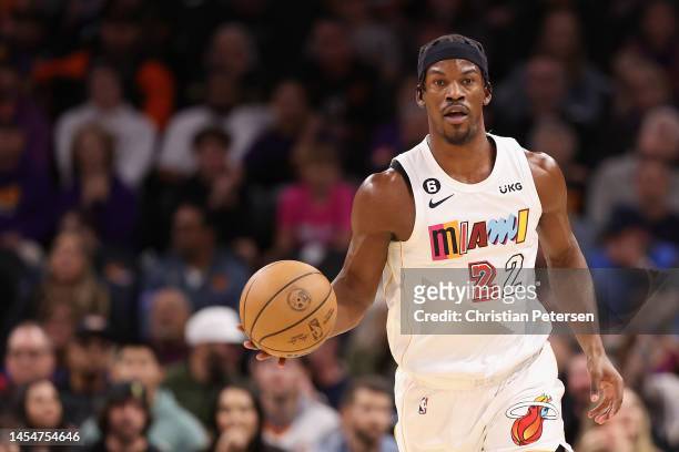 Jimmy Butler of the Miami Heat handles the ball during the first half of the NBA game against the Phoenix Suns at Footprint Center on January 06,...
