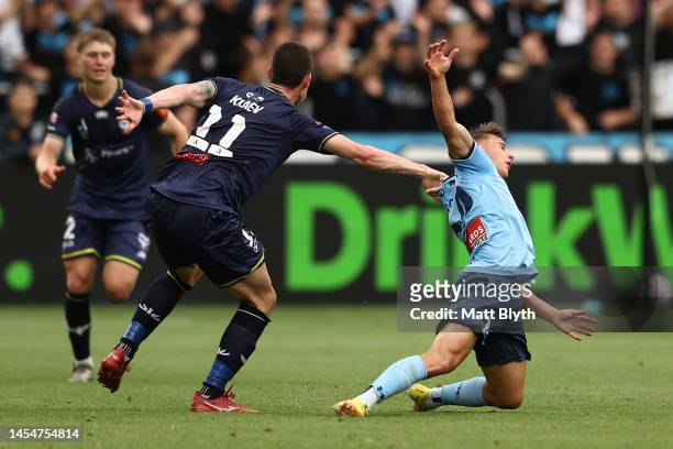 Adrian Segecic of Sydney FC is tackled by Bozhidar Kraev of the Phoenix during the round 11 A-League Men's match between Sydney FC and Wellington...