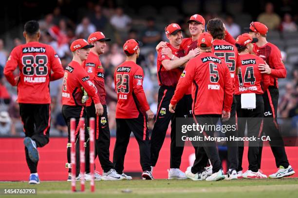 Tom Rogers and Will Sutherland of the Renegades celebrate the wicket of Matthew Wade of the Hurricanes during the Men's Big Bash League match between...