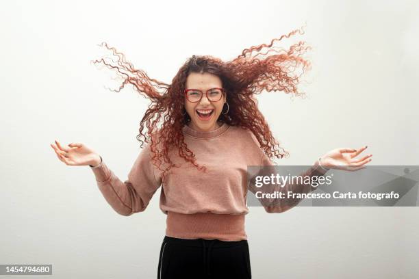 portrait of carefree woman - hair blowing stockfoto's en -beelden