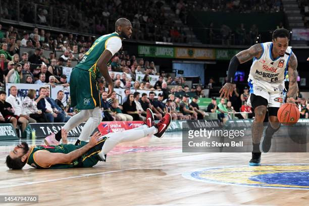 Rayjon Tucker of Melbourne United knocks Jarrad Weeks of the Jackjumpers to the floor as he drives to the basket during the round 14 NBL match...