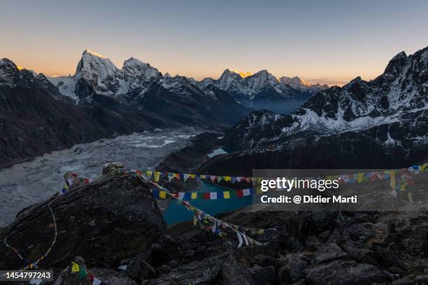 sunset over the himalayas from gokyo ri in nepal - himalaya building stock pictures, royalty-free photos & images