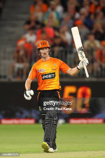 Cameron Bancroft of the Scorchers raises his bat after reaching his half century during the Men's Big Bash League match between the Perth Scorchers...