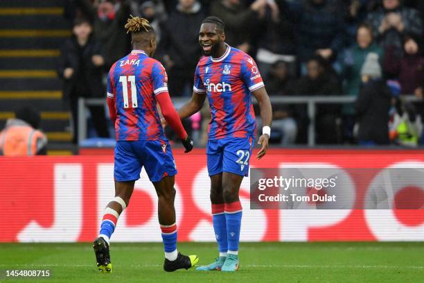 Odsonne Edouard of Crystal Palace celebrates with teammate Wilfried Zaha after scoring the team's first goal during the Emirates FA Cup Third Round...