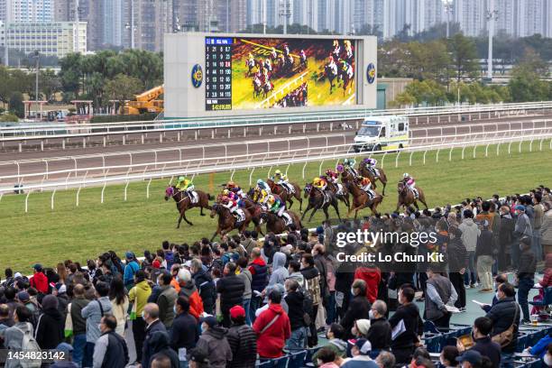 January 1 : Jockeys compete the Race 10 Chinese Banyan Handicap at Sha Tin Racecourse on January 1, 2023 in Hong Kong.