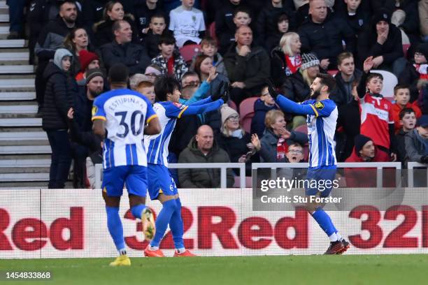 Adam Lallana of Brighton & Hove Albion celebrates after scoring the team's second goal during the Emirates FA Cup Third Round match between...