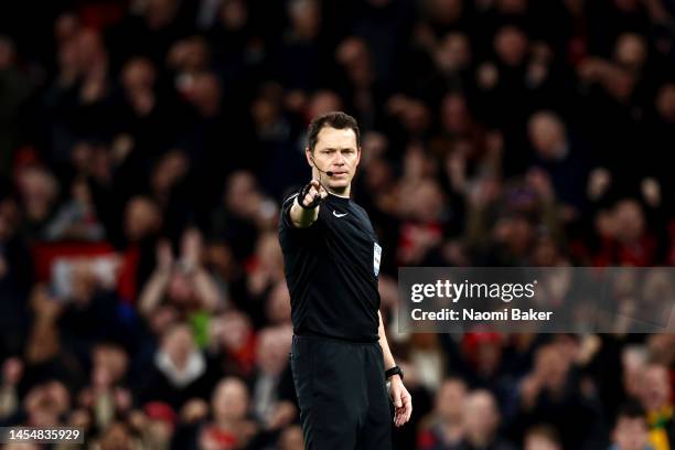 Darren England, match referee points to the penalty spot during the Emirates FA Cup Third Round match between Manchester United and Everton at Old...