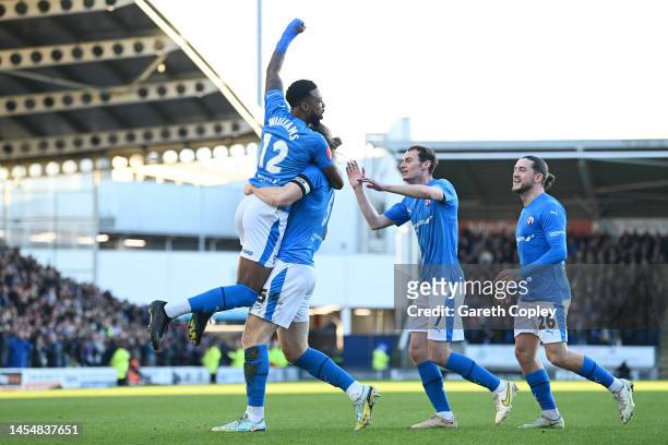 Tyrone Williams of Chesterfield celebrates with teammates after scoring the team's first goal during the Emirates FA Cup Third Round match between...