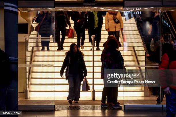 Several people enter and leave a commercial establishment, on January 7 in Madrid, Spain. Although online sales and discounts had already begun in...