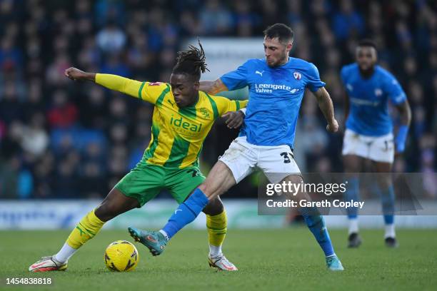 Brandon Thomas-Asante of West Bromwich Albion battles for possession with Mike Jones of Chesterfield during the Emirates FA Cup Third Round match...