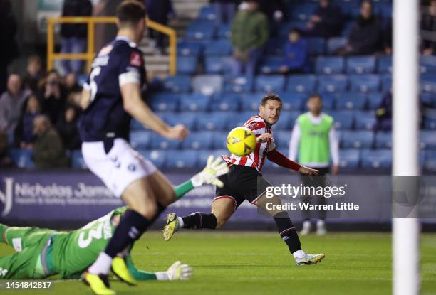 Billy Sharp of Sheffield United has a shot saved by Bartosz Bialkowski of Millwall during the Emirates FA Cup Third Round match between Millwall FC...