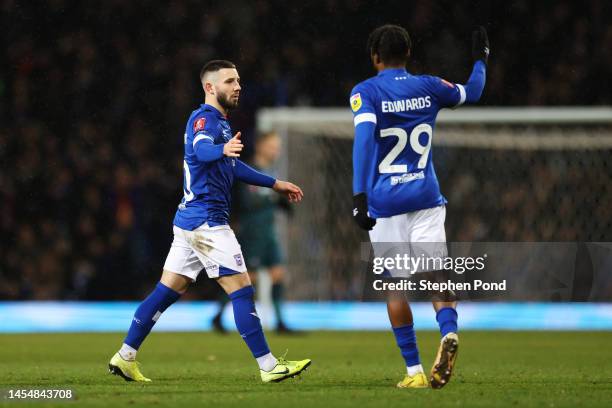 Conor Chaplin of Ipswich Town interacts with teammate Kyle Edwards as he is substituted during the Emirates FA Cup Third Round match between Ipswich...