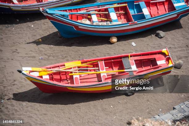 fishing boats on fishermen bay beach at cidade velha on santiago island, cape verde. - cidade velha stock-fotos und bilder
