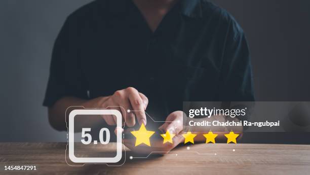 customer giving a five star rating.men using technology internet on smart phone giving positive review for client's satisfaction surveys. evaluation feedback. service rating, satisfaction concept. - computer questionnaire stock pictures, royalty-free photos & images