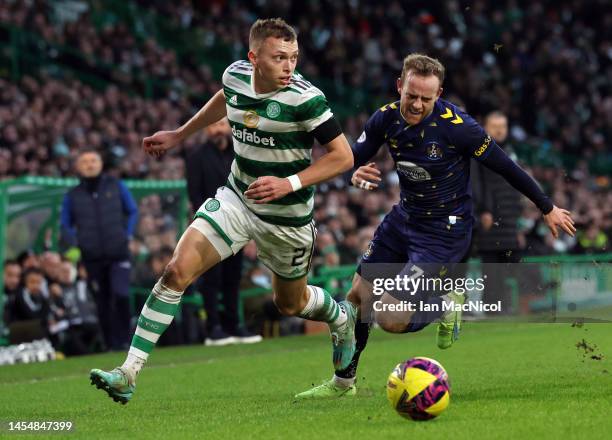 Alastair Johnston of Celtic evades Rory McKenzie of Kilmarnock during the Cinch Scottish Premiership match between Celtic FC and Kilmarnock FC at on...