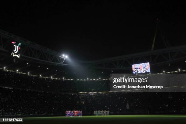 An image of Former Cremonese, Juventus, Sampdoria, Chelsea and Italy Gianluca Vialli is projecterd onto the stadium screen as a minute's silence is...