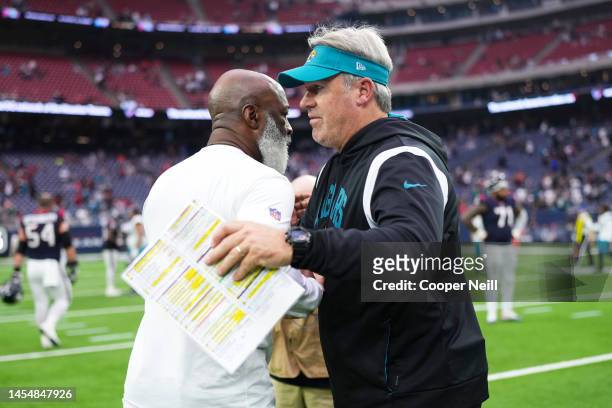 Head coach Doug Pederson of the Jacksonville Jaguars speaks with head coach Lovie Smith of the Houston Texans at NRG Stadium on January 1, 2023 in...