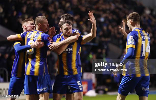 Matthew Pennington of Shrewsbury Town celebrates with teammates after scoring the teams first goal during the Emirates FA Cup Third Round match...