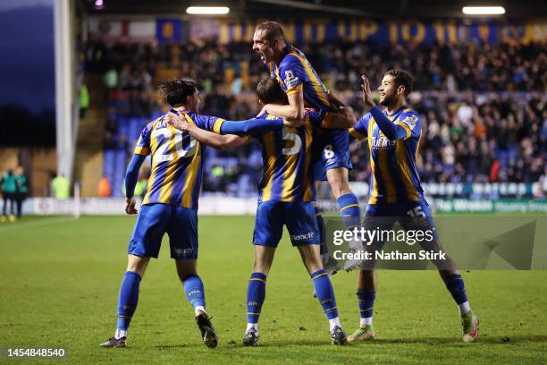 Matthew Pennington of Shrewsbury Town celebrates with teammates after scoring the teams first goal during the Emirates FA Cup Third Round match...
