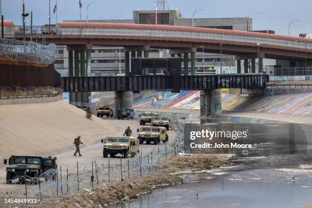 Texas National Guard soldiers stand guard at the U.S.-Mexico border on January 07, 2023 as viewed from Ciudad Juarez, Mexico. U.S. President Joe...