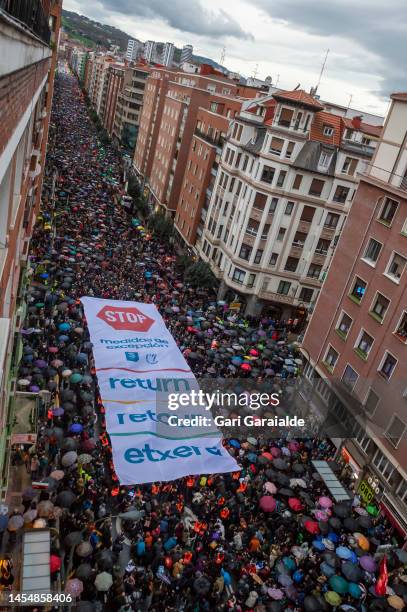 Banner reading Stop exceptional prison policy is seen as thousands march during a demonstration organized by the association Etxerat and the...