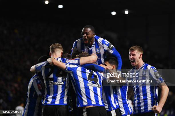 Josh Windass of Sheffield Wednesday celebrates with team mates after scoring their sides second goal during the Emirates FA Cup Third Round match...