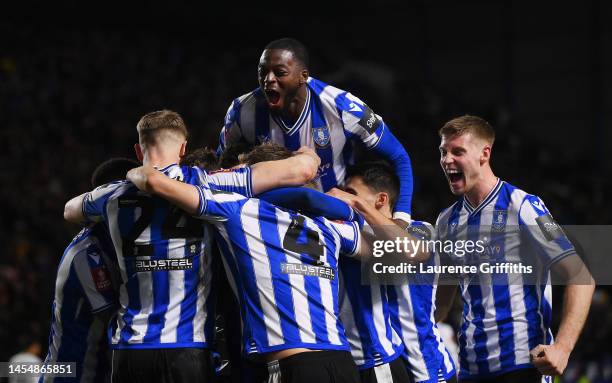 Josh Windass of Sheffield Wednesday celebrates with team mates after scoring their sides second goal during the Emirates FA Cup Third Round match...