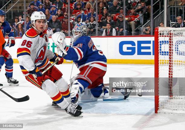 Jack Hughes of the New Jersey Devils scores a second period goal against Igor Shesterkin of the New York Rangers at the Prudential Center on January...